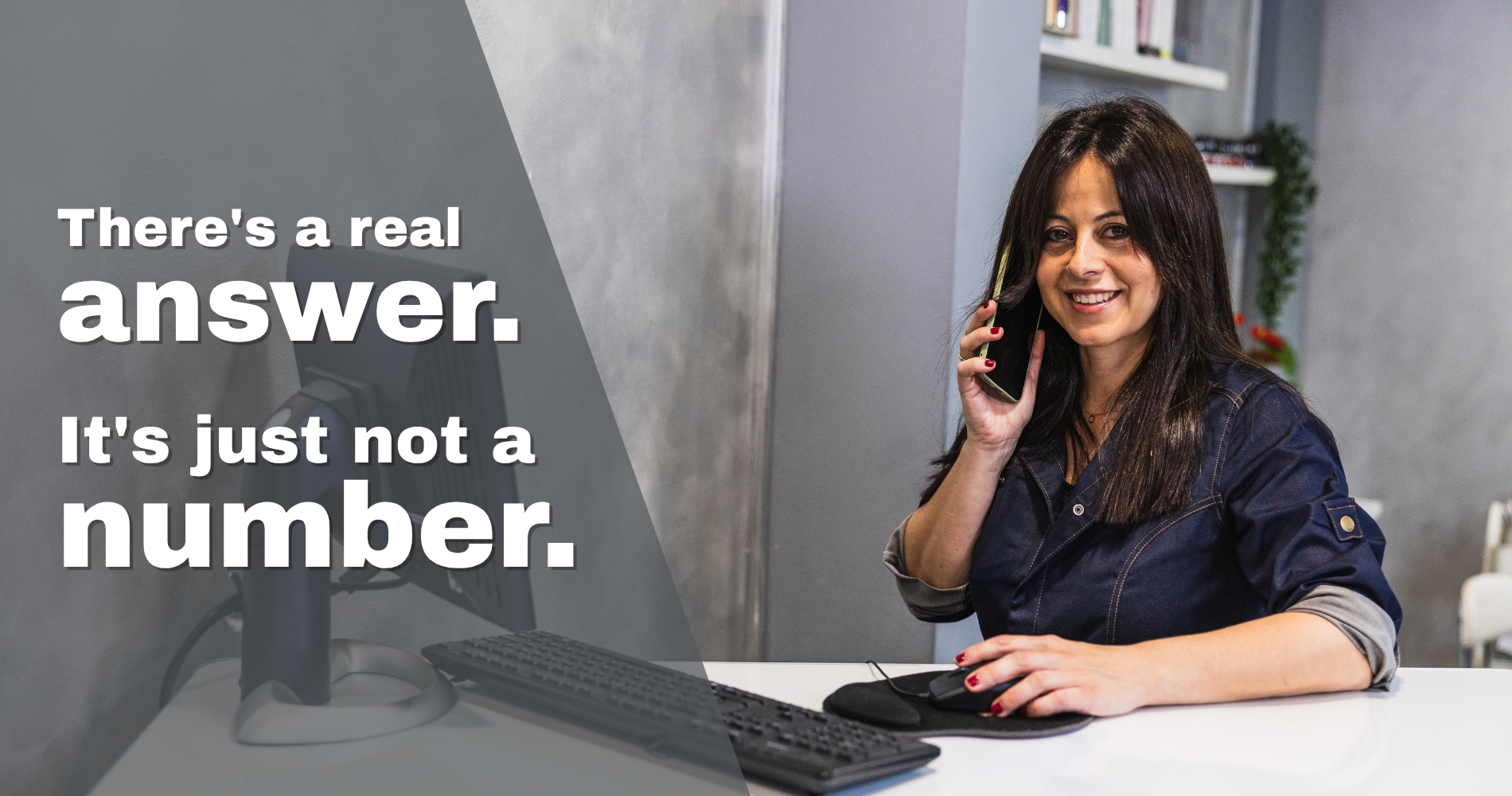 Woman on the phone at a laptop, responding to a local business enquiry
